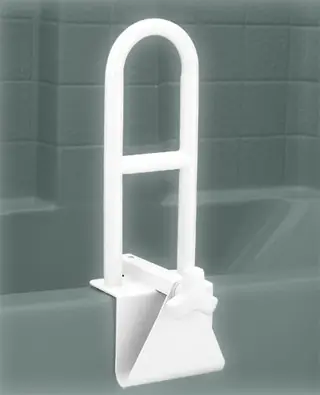 A white bathtub handle with a tub in the background.