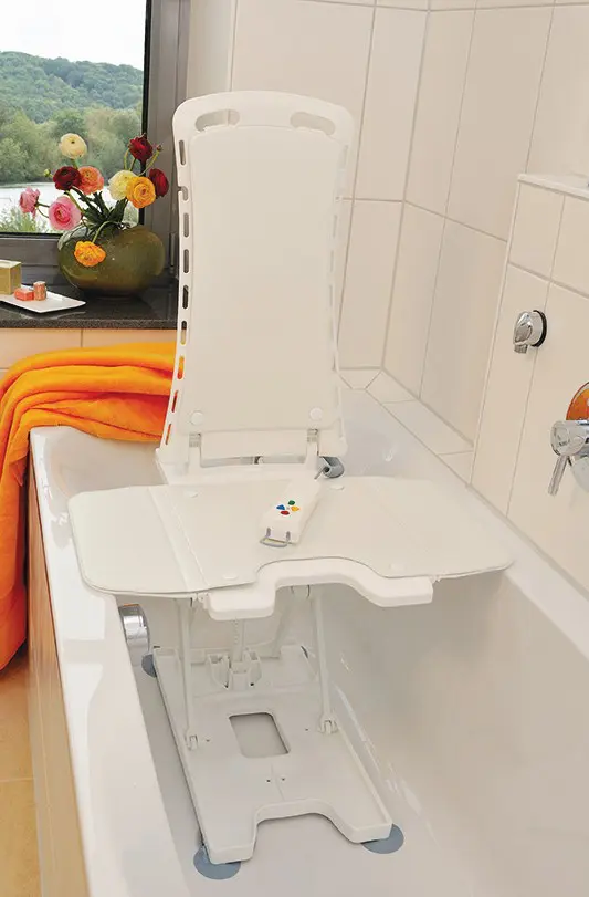 A white bathtub with a sink and a towel.